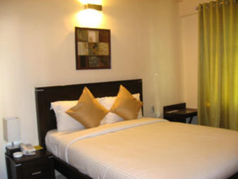 Hotel The Elite Suites Pune Værelse billede