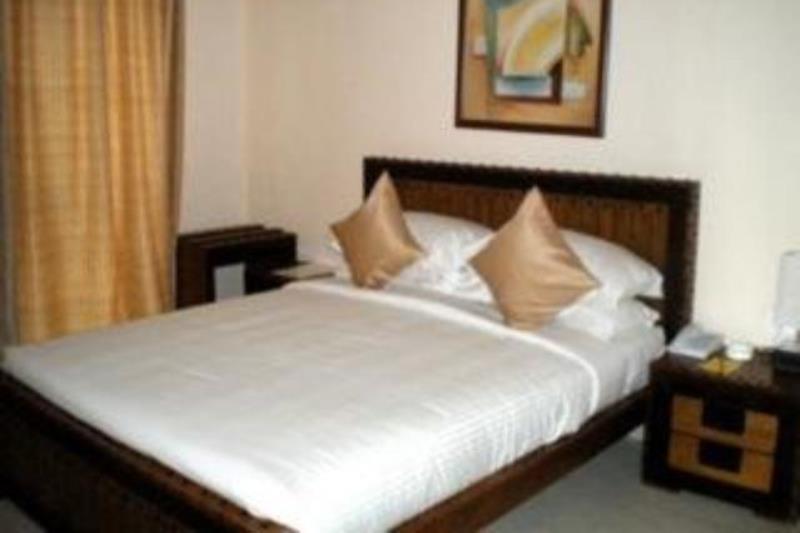 Hotel The Elite Suites Pune Værelse billede