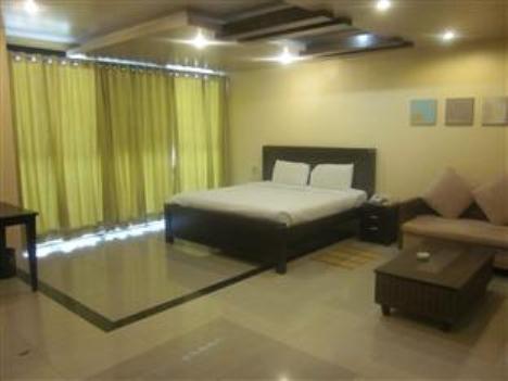 Hotel The Elite Suites Pune Værelse billede
